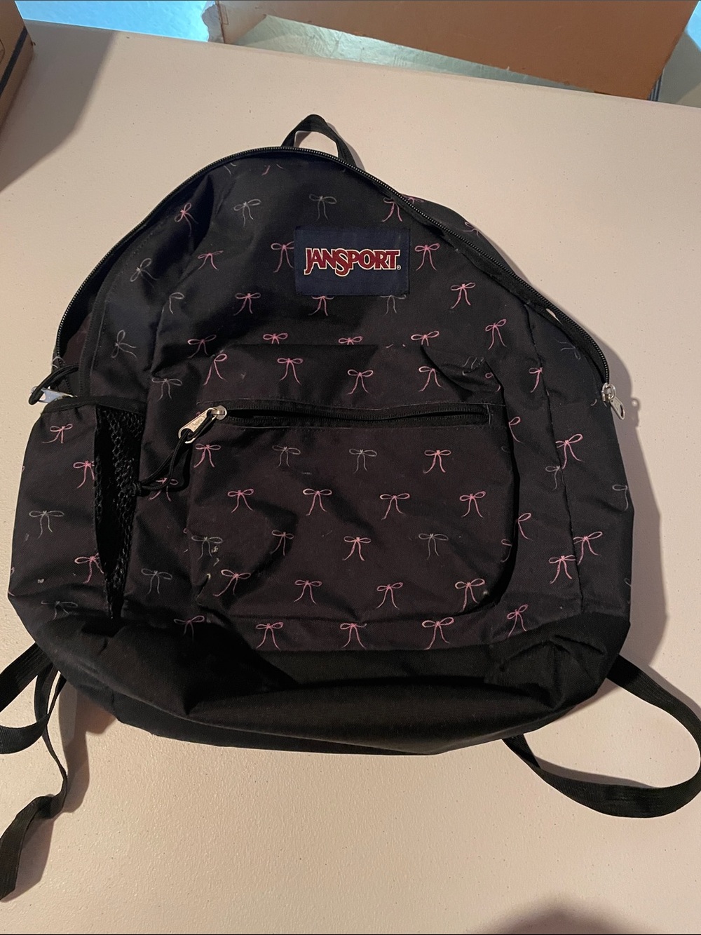 Jansport Black Backpack with Pink Bow Print